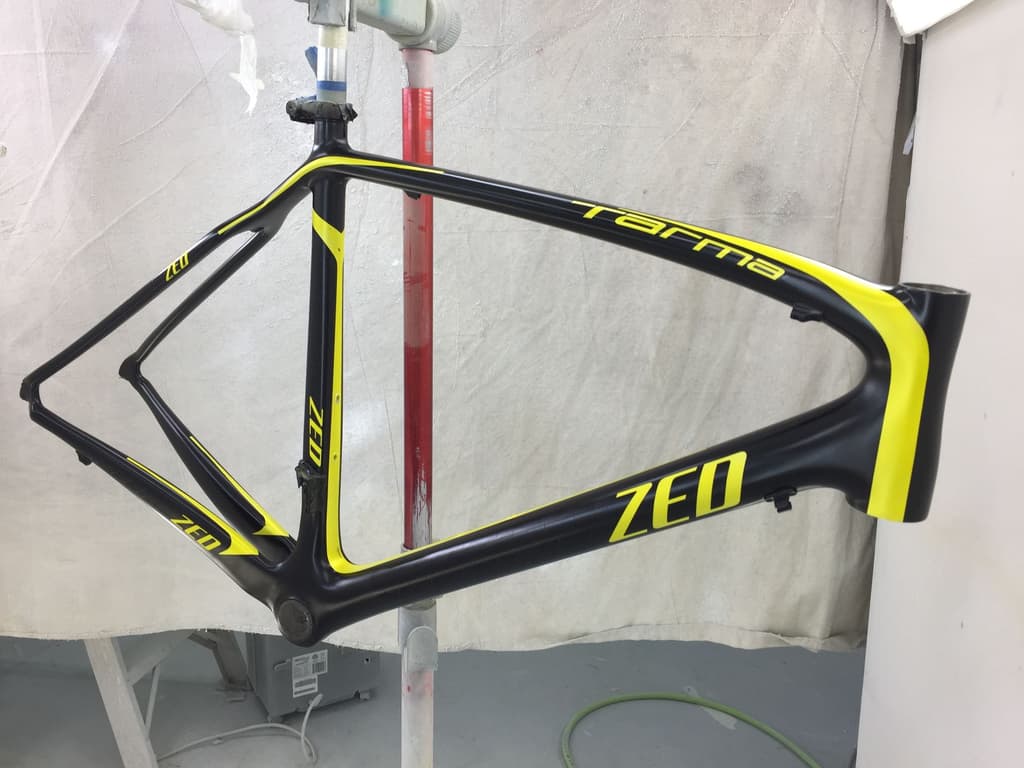 Road frame refinished in black with bright yellow accent graphics.
