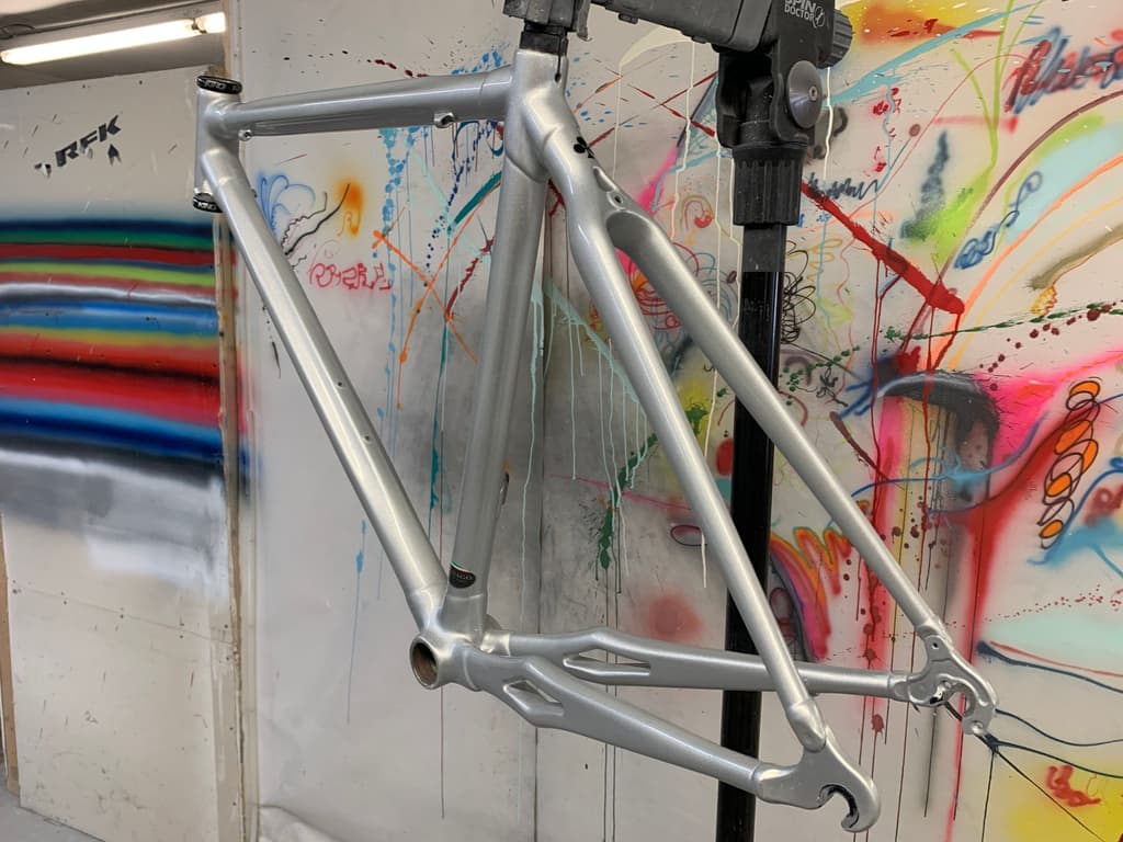 Colnago metal-frame road bike refinished in a bright silver.