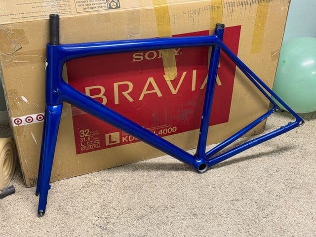 Finished gloss frame photographed indoors at a customer's home after refinishing.