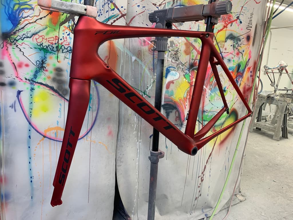 Aero road frame refinished in a single-color gloss red.