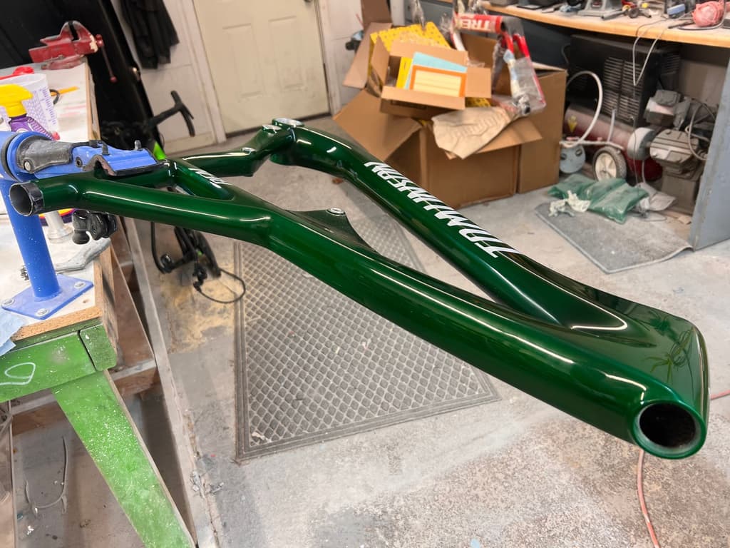 Transition mountain bike frame refinished in a deep gloss green with reproduced factory-style lettering.