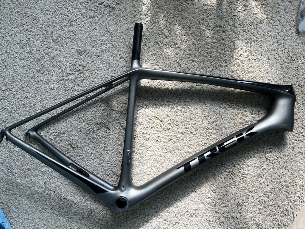 Trek road frame refinished in a gloss grey single-color paint job.